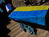 Demonstrators carry symbolic body caskets into The New York Avenue Presbyterian Church during an anti-war protest in Washington, D.C. on Mar...
