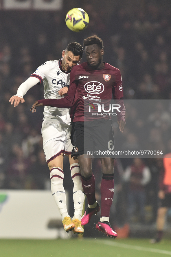 Junior Sambia of US Salernitana  competes for the ball with celebrates after scoring goal  Stefan Posch of Bologna FC   during the Serie A m...