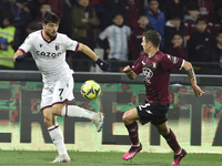 Riccardo Orsolini of Bologna FC  competes for the ball with  Norbert Gyomber of US Salernitana during the Serie A match between US Salernita...