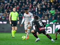 Udinese's Destiny Iyenoma Udogie in action against Milan's Sandro Tonali during the italian soccer Serie A match Udinese Calcio vs AC Milan...
