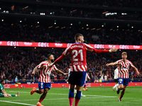 Yannick Carrasco, Memphis Depay and Marcos Llorente celebrates a goal during La Liga match between Atletico de Madrid and Valencia CF at Civ...