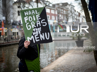 Activist at the entrance of a restaurant that serves foie gras, in Utrecht, Netherlands, on March 18, 2023.  (