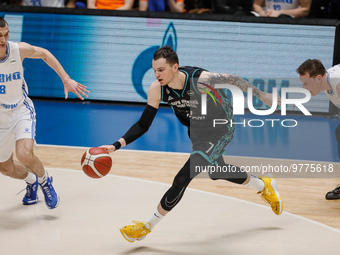 Maksim Salash (C) of Nizhny Novgorod in action against Igor Volkhin (L) and Dmitry Kulagin of Zenit during the Russian Cup Final Four final...