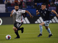 March 18, 2023, Frisco, United States: FC Dallas midfielder Sebastian Lletget is chased by Sporting KC midfielder Remi Walter during first h...
