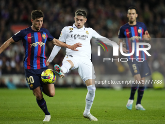Federico Valverde central midfield of Real Madrid and Uruguay and Sergi Roberto right-back of Barcelona and Spain compete for the ball durin...