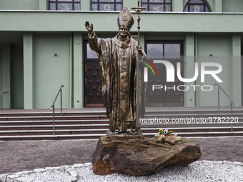 A statue of pope John Paul II standing in front of St. Hedwig Church in Pszczyna, Silesia region of Poland on March 20, 2023. Poland's parli...