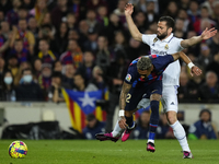 Raphinha right winger of Barcelona and Brazil and Nacho Fernandez centre-back of Real Madrid and Spain compete for the ball during the La Li...