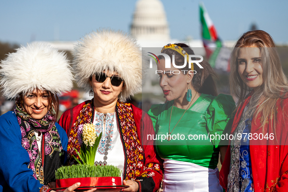 Women in traditional dress take part in a Nowruz celebration on the National Mall. The holiday has its roots in Zoroastrianism and celebrate...