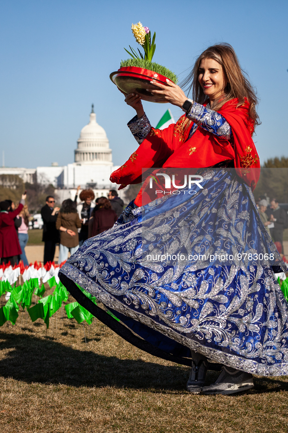 Mina Yousefi, of the Washington, DC area, a celebrates Nowruz on the National Mall. The holiday has its roots in Zoroastrianism and celebrat...