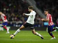 Nico Gonzalez central midfield of Valencia and Spain controls the ball during the La Liga Santander match between Atletico de Madrid and Val...