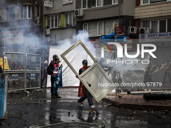 Protestors clashed with police on May Day in Istanbul on May 1, 2014. Turkish police used water canons and tear gas to disperse thousands of...