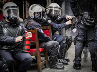 Riot Police who prevent demonstrators from reaching Taksim Square in Istanbul for a May Day rally on May 1, 2014. Turkish police used water...