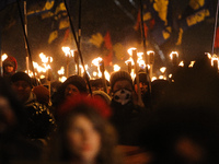 Hundreds of activists and supporters of Ukrainian nationalists march with torches and flags in downtown Kiev during a rally confined to the...