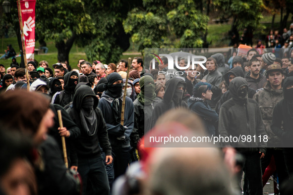 Demonstrators clash with the police during a march held in the framework of May Day on May 1, 2014 in Santiago, Chile. 