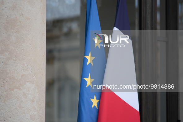 The French and European flags at the entrance to the Elysee Palace, in Paris, on March 27, 2023. 