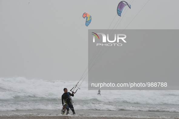 Kite surfers in the Mediterranean Sea on a stormy weather in the coastal city Herzliya, North of Tel-Aviv on January 08, 2016.  