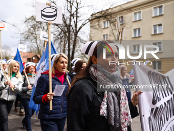 Polish nurses and midwives of hospitals from all the country take part in a protest marching through the streets of Krakow, Poland, on April...