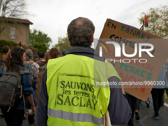 A protester wears a shirt reading 'Let's us save the Saclay soils'. More than 8000 protesters marched 12km against the planned A69 highway....