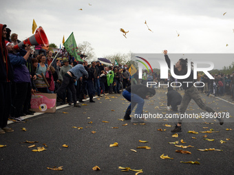 Protesters throw banana peels to each other during a game during the protest. More than 8000 protesters marched 12km against the planned A69...