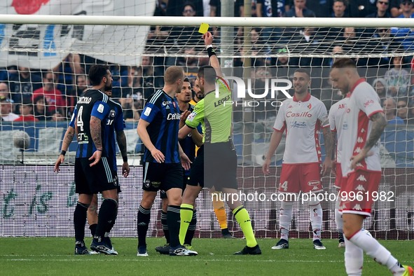 The referee Andrea Colombo shows yellow card to Gaetano Masucci (Pisa) during the Italian soccer Serie B match AC Pisa vs SSC Bari on April...