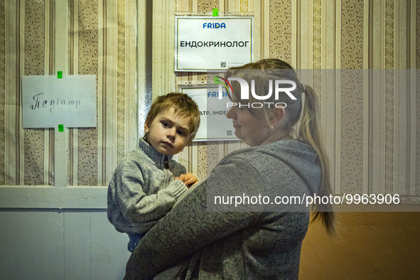A mother with her child wait for medical consultation in Pisky Radkivski by doctors of FRIDA NGO. FRIDA NGO is a crew of Israeli and Ukraini...