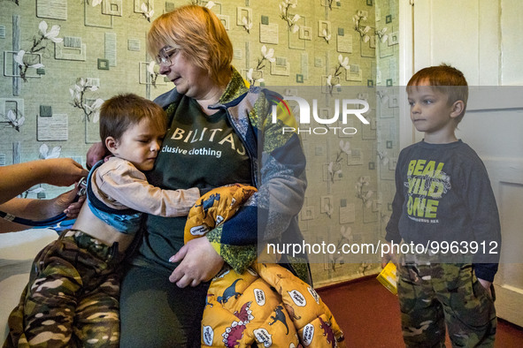 A doctor from the NGO FRIDA checks on a child in Pisky Radkivski. FRIDA ONG is a team of Israeli and Ukrainian doctors and assistants who he...