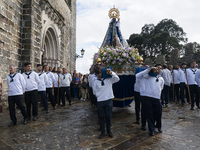 The participants in sailor suits, take out the figure of the virgin from the church to start the procession of La Folia, with the virgin of...