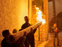 The residents of Argyroupoli village in Rethymno, Greece, in order to honour the dead Jesus but also to illuminate the route followed by the...