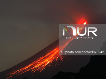 Mount Merapi, a volcanic mountain spews lava as it erupts several times as seen from Turgo village, Sleman district in Yogyakarta, Indonesia...