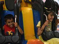 Children Enjoy a Ride at Shamoli Shishu Park during Eid vacation in Dhaka, Bangladesh on April 26, 2023.  (