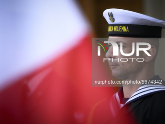 A member of the Polish Navy is seen with a Polish flag at the Palace on the Isle in Warsaw, Poland on 26 April, 2023. The Bucharest Nine is...