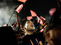 Fans celebrate as Palermo returns to Serie A after winning the game against Novara, on May 3, 2014. (