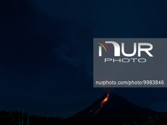 Mount Merapi, a volcanic mountain spews lava as it erupts several times as seen from Tunggularum village, Sleman district in Yogyakarta, Ind...