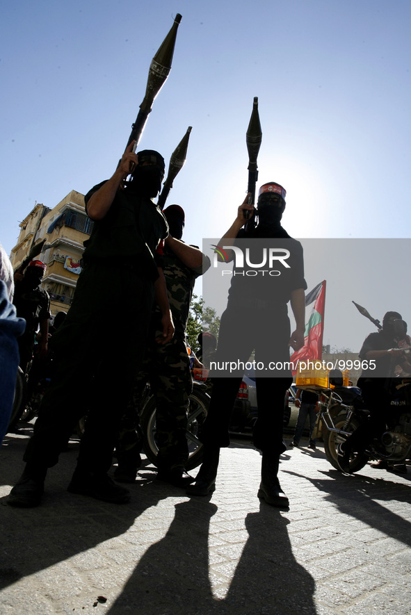 Palestinian militants from the Popular Front for the Liberation of Palestine (PFLP) stage a parade in Khan Yunis in the southern Gaza Strip...