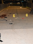 Crime Scene Investigators Mark Shell Casings And Other Evidence At A Fatal Shooting In Brooklyn New York