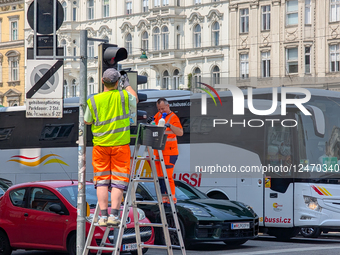Municipal Workers Cleaning Traffic Lights In Vienna
