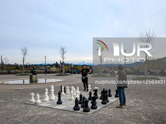Outdoor Chess Match With A View Of The Alps