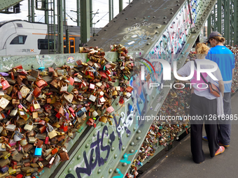 People Viewing Love Locks At Hohenzollern Bridge