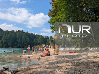 People Enjoy Summer At Bavarian Alp Lake