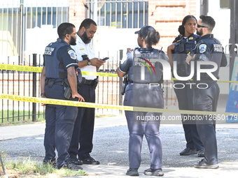 Metropolitan Police Department Officers Investigate Crime Scene Where A Man Was Grazed In A Shooting On The 4600 Block Of Martin Luther King Jr. Avenue Southwest