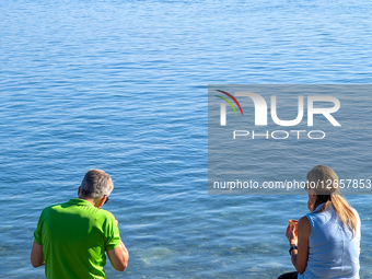 Couple By Lake In Summer
