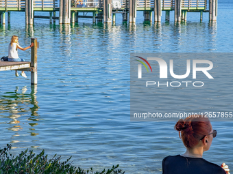 Two Women At The Lake In Summer