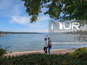 Friends Walking At Lake