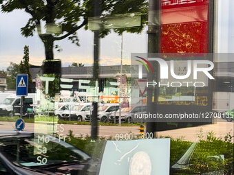 Tesla Dealership Storefront In Zurich Showing Signs Of Vandalism
