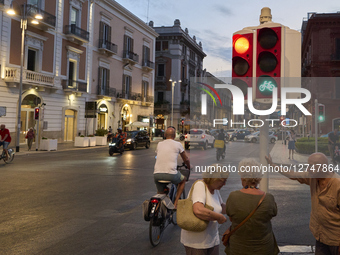 Evening City Traffic With Cyclists And Pedestrians At Traffic Light