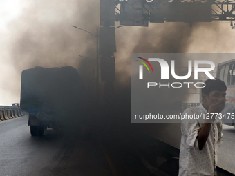 Choking Streets: Toxic Smoke From A Truck