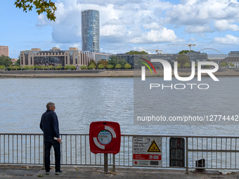 Warning Sign And Lifebuoy At The Rhine River
