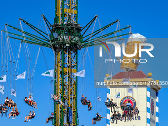 Swing Ride And Paulaner Tower At Oktoberfest