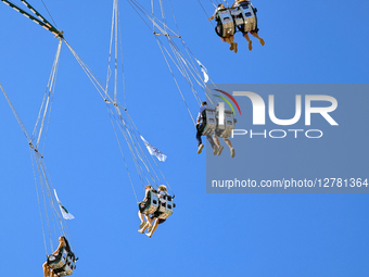 Swing Ride Against Blue Sky At Oktoberfest