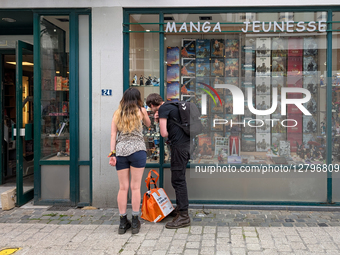 Manga Storefront With Young Couple